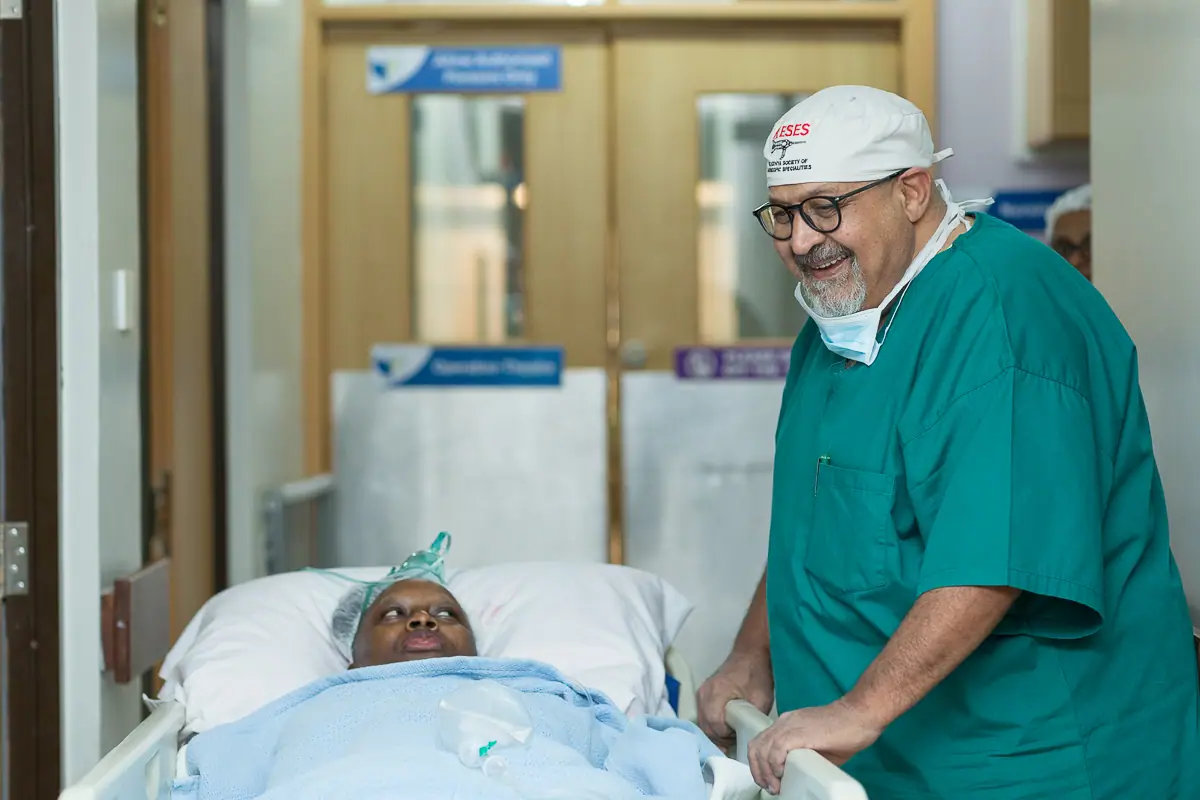 Prof. Rafique Parkar with a patient at KLASS Nairobi