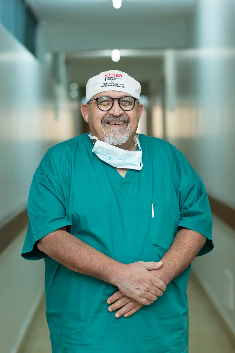 Prof. Parkar in surgical scrubs at KLASS Nairobi